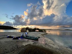 The research team packs up the raft after a day of coring