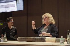 Transdisciplinary Core Reading of the Crawford Lake drill core during "Unearthing the Present at HKW", with Michelle Murphy (left) and Francine McCarthy (right).