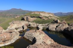 Nearby archaeological sites and rock art document millennia of hunter gatherer presence in this high altitude area.